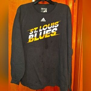 An Adidas St. Louis Blues long sleeve t-shirt in a men's size XL.  Pre-loved